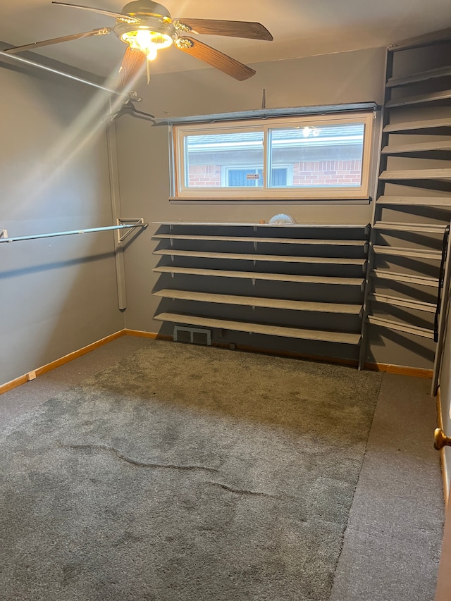 interior space featuring ceiling fan and carpet floors