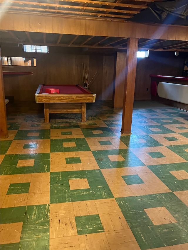 basement featuring wooden walls and billiards