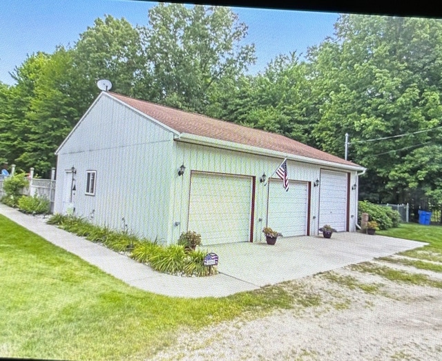 garage with a yard