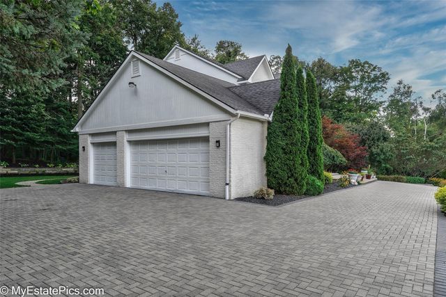 view of property exterior with a garage