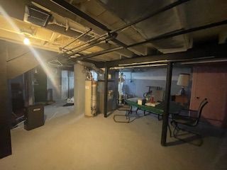 basement featuring gas water heater