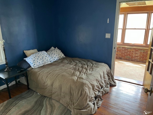 bedroom featuring wood-type flooring