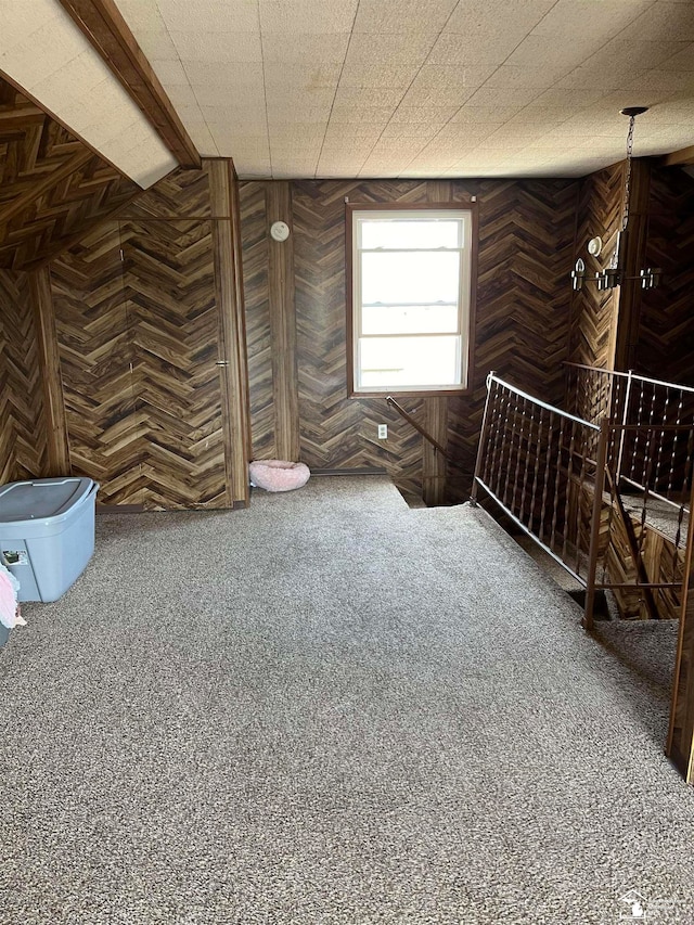 interior space with wood walls and vaulted ceiling