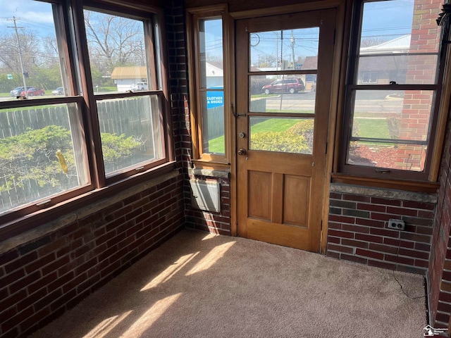 unfurnished sunroom with plenty of natural light