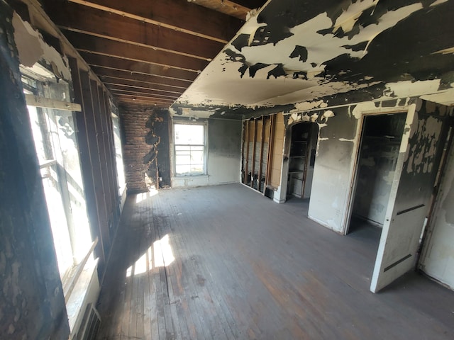 spare room featuring visible vents and wood finished floors