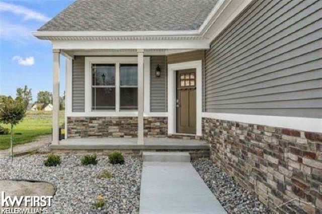 property entrance featuring covered porch