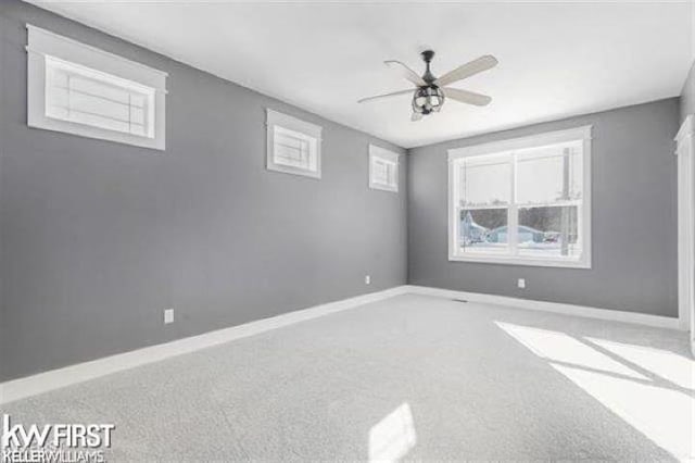 unfurnished room featuring carpet flooring and ceiling fan