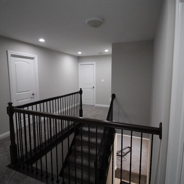 staircase with carpet floors