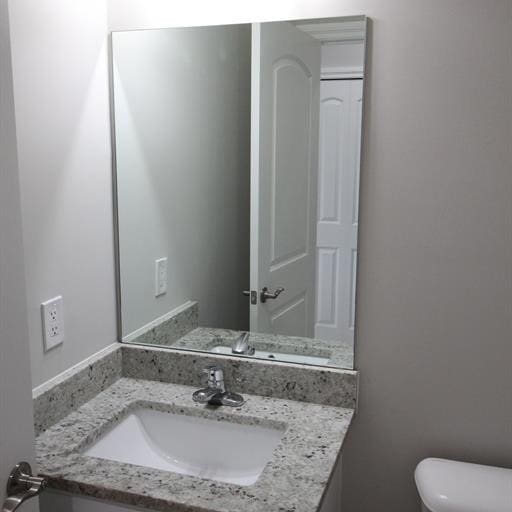 bathroom with vanity and toilet