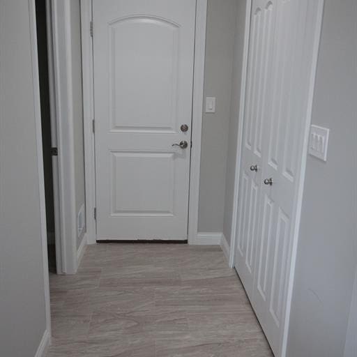 hall with light hardwood / wood-style flooring