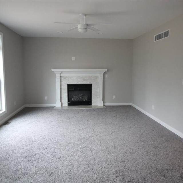 33690 N Bostwick, Farmington Hills, MI 48335 - unfurnished living room featuring a ceiling fan, carpet flooring, baseboards, and a fireplace with flush hearth
