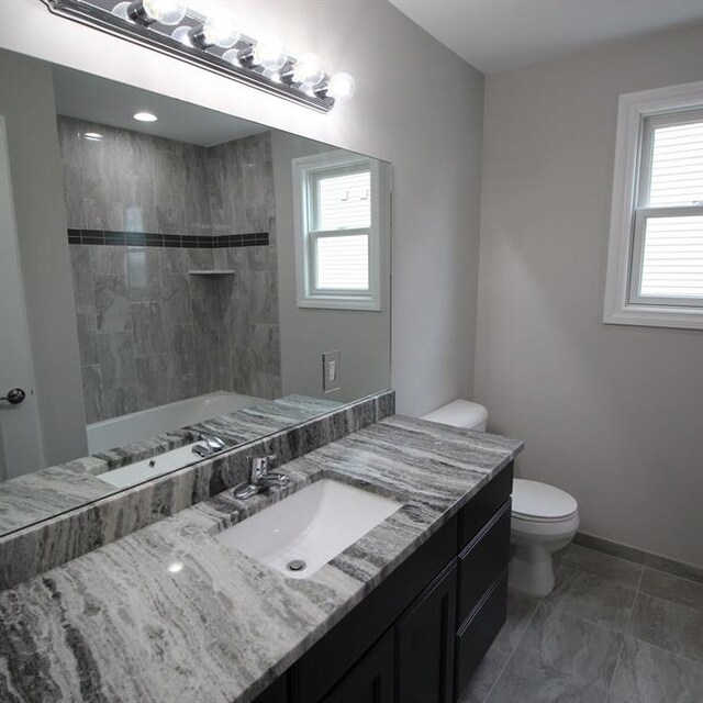 33690 N Bostwick, Farmington Hills, MI 48335 - bathroom with toilet, vanity, plenty of natural light, and baseboards