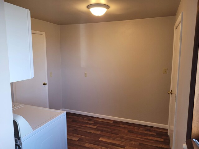 1299 Sand Beach Rd, Bad Axe, MI 48413 - laundry room featuring dark wood-style floors and baseboards
