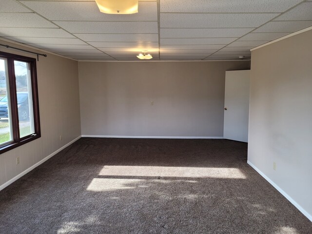 1299 Sand Beach Rd, Bad Axe, MI 48413 - carpeted empty room featuring a paneled ceiling and baseboards