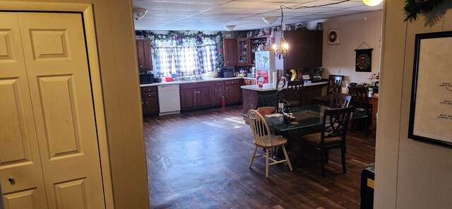 1299 Sand Beach Rd, Bad Axe, MI 48413 - dining area with dark wood-style flooring and a paneled ceiling