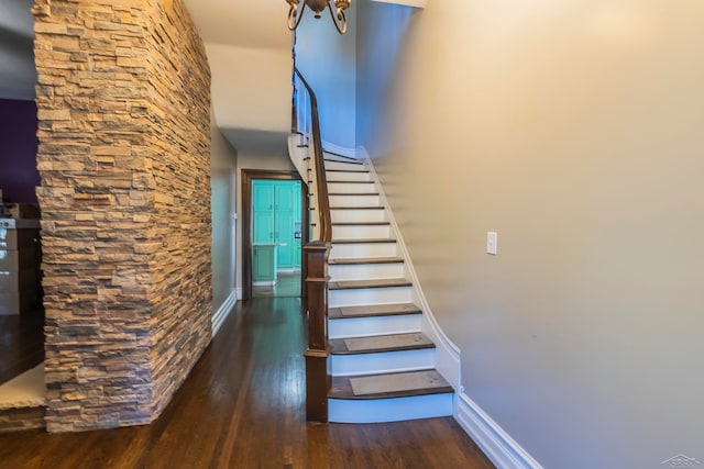 staircase featuring hardwood / wood-style flooring