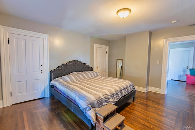 bedroom featuring dark hardwood / wood-style flooring