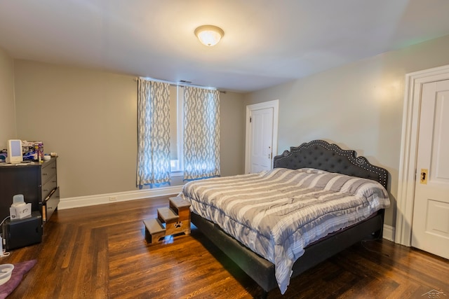 bedroom featuring dark hardwood / wood-style floors