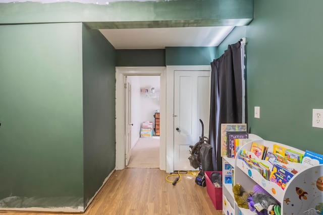 corridor featuring light hardwood / wood-style floors