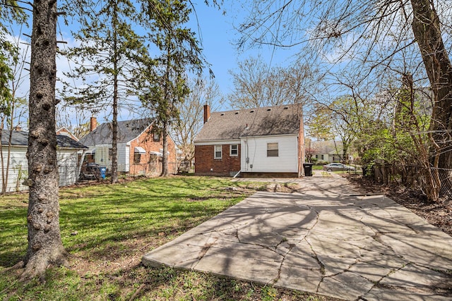 back of house featuring a yard