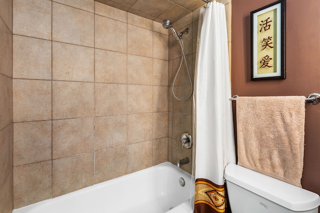 bathroom with shower / bath combination with curtain and toilet