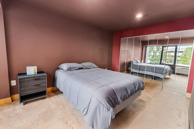 carpeted bedroom featuring a closet