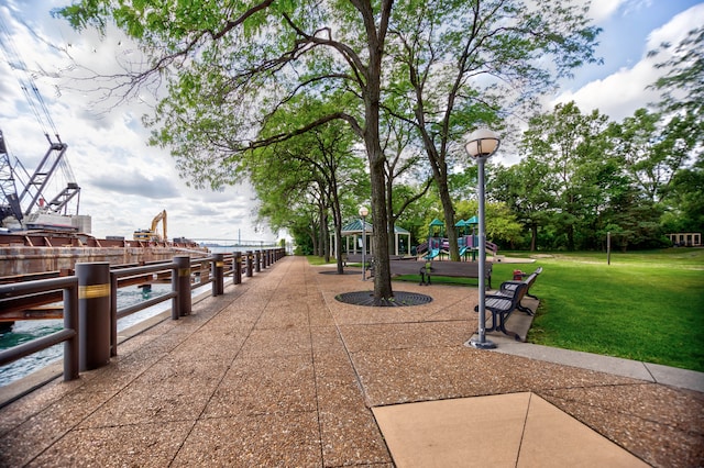 view of community with a playground and a yard