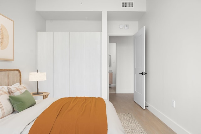 bedroom featuring light hardwood / wood-style floors