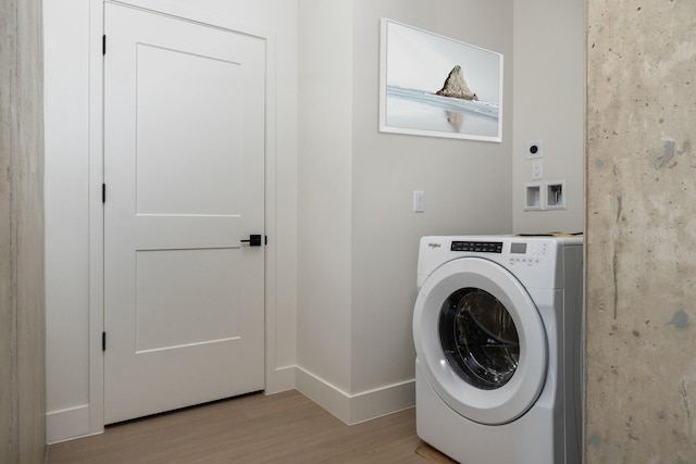 washroom featuring washer / dryer and light wood-type flooring