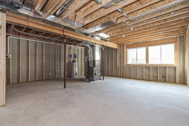 basement featuring heating unit and gas water heater