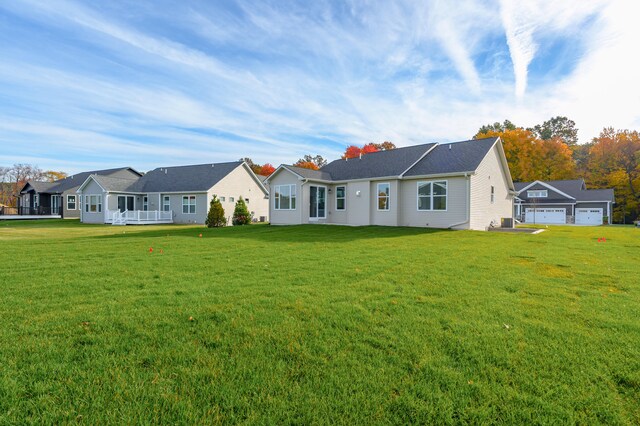 ranch-style house with a garage and a front yard