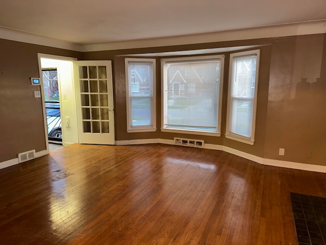 spare room featuring hardwood / wood-style flooring