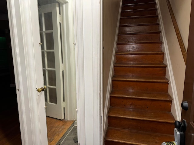 stairs with hardwood / wood-style flooring