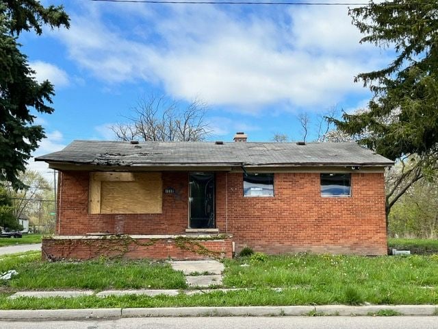12326 Garnet St, Detroit, MI 48205 - view of front of home with brick siding and a chimney
