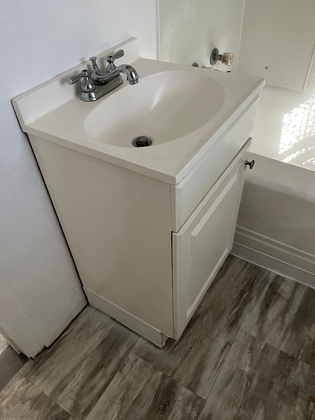 bathroom featuring vanity and wood-type flooring