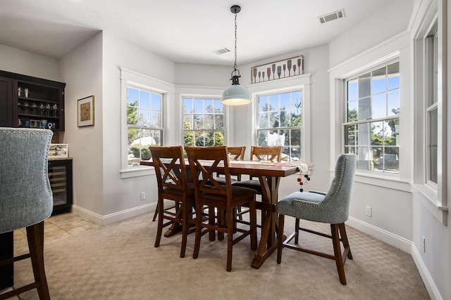 3975 Harbor Breeze Dr, Norton Shores, MI 49441 - dining space featuring plenty of natural light, light carpet, and baseboards