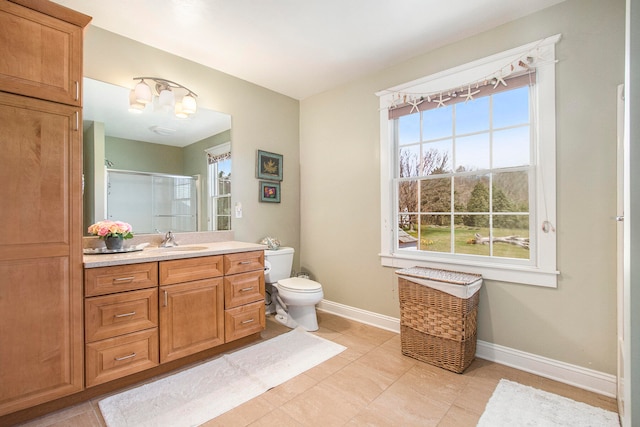 3975 Harbor Breeze Dr, Norton Shores, MI 49441 - full bath featuring toilet, vanity, baseboards, a shower with shower door, and tile patterned floors
