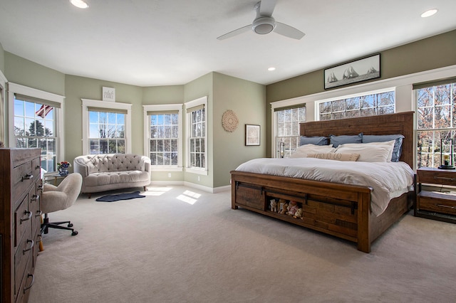 3975 Harbor Breeze Dr, Norton Shores, MI 49441 - carpeted bedroom featuring multiple windows, recessed lighting, baseboards, and a ceiling fan