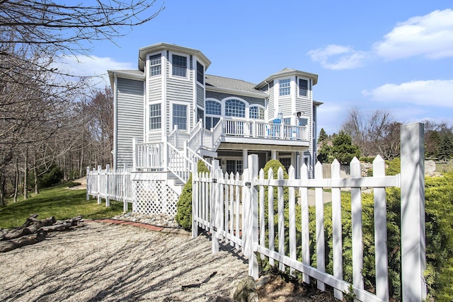 3975 Harbor Breeze Dr, Norton Shores, MI 49441 - back of property with a wooden deck
