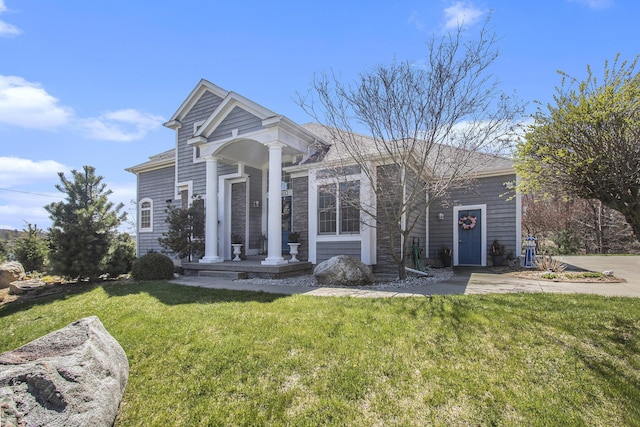 3975 Harbor Breeze Dr, Norton Shores, MI 49441 - view of front of home featuring a front yard and a shingled roof