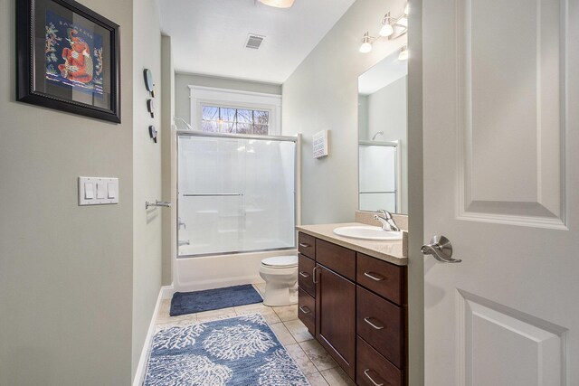3975 Harbor Breeze Dr, Norton Shores, MI 49441 - bathroom with toilet, vanity, shower / bath combination with glass door, and tile patterned flooring