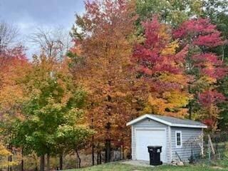 3975 Harbor Breeze Dr, Norton Shores, MI 49441 - detached garage featuring a storage unit