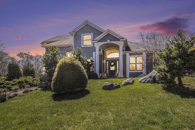 3975 Harbor Breeze Dr, Norton Shores, MI 49441 - view of front of property with a yard and roof with shingles
