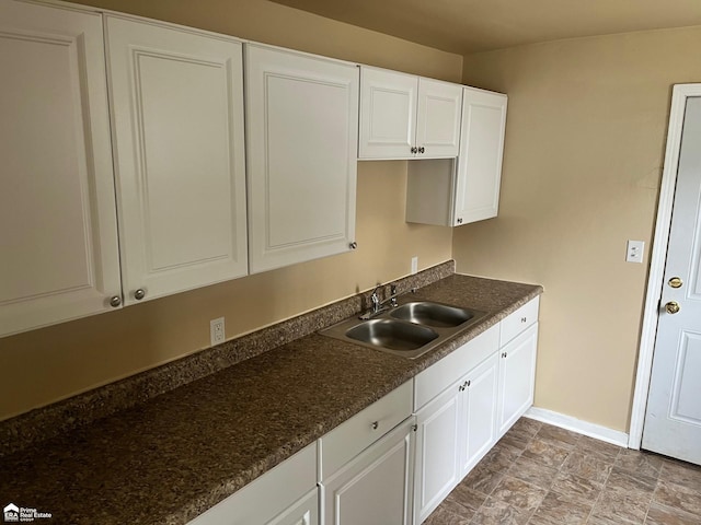 kitchen with sink and white cabinets