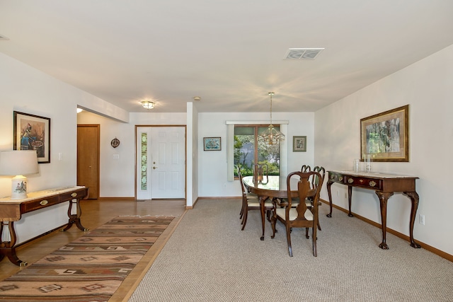 dining space featuring a chandelier