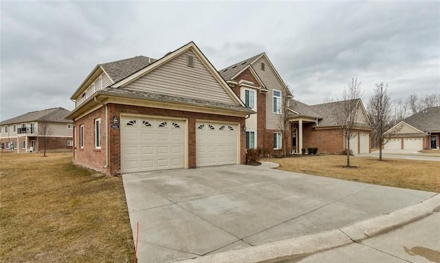 view of front facade with a front yard and a garage