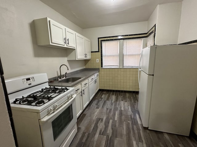 kitchen featuring white cabinetry, white appliances, sink, and tile walls