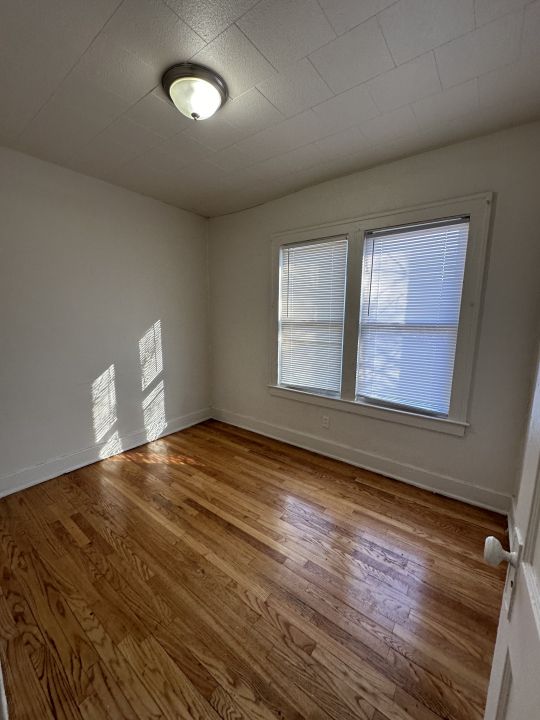 empty room featuring hardwood / wood-style floors