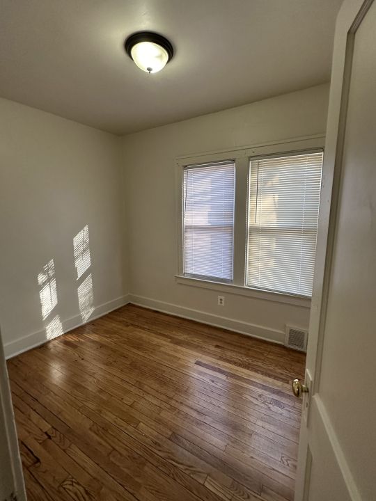 empty room featuring dark hardwood / wood-style floors