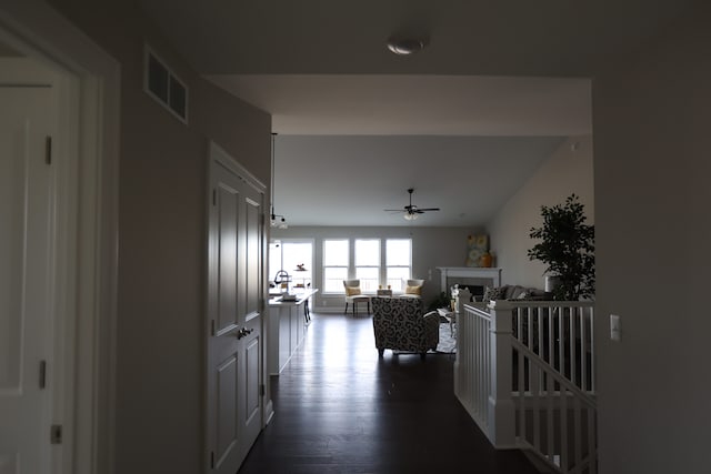 hall with dark hardwood / wood-style flooring and sink